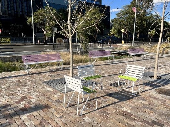 Custom Emerdyn Garden Furniture, EM053 chair and EM054 seat with armrests and painted timber battens - Penrith City Park.jpg